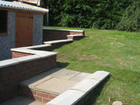 Rear garden steps brickwork and concrete garage 